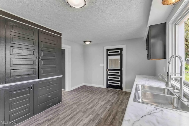 13050 Diagonal Rd, Salem, OH 44460 - kitchen with dark wood finished floors, a textured ceiling, and light stone countertops