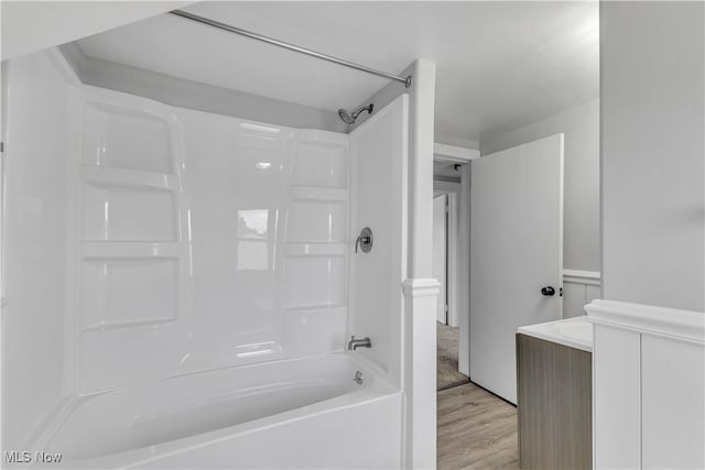 13050 Diagonal Rd, Salem, OH 44460 - bathroom with washtub / shower combination, wood finished floors, and vanity