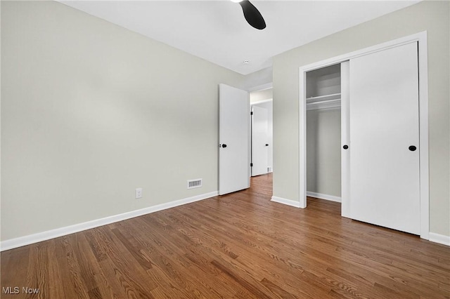 738 Sterling Rd, Wickliffe, OH 44092 - unfurnished bedroom with wood finished floors, a ceiling fan, and a closet