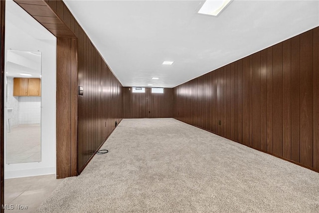738 Sterling Rd, Wickliffe, OH 44092 - spare room with wood walls and carpet flooring