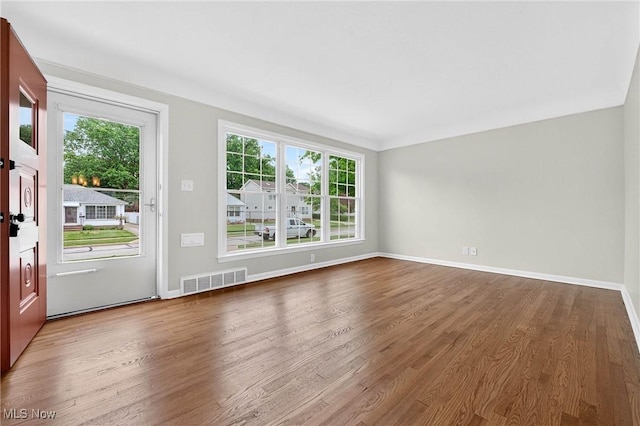 738 Sterling Rd, Wickliffe, OH 44092 - empty room featuring healthy amount of natural light and wood finished floors