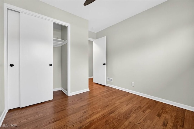 738 Sterling Rd, Wickliffe, OH 44092 - unfurnished bedroom with a closet, wood finished floors, and a ceiling fan