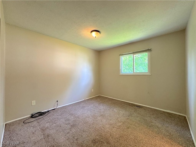 24525 Sherborne Rd, Bedford Heights, OH 44146 - carpeted spare room featuring a textured ceiling
