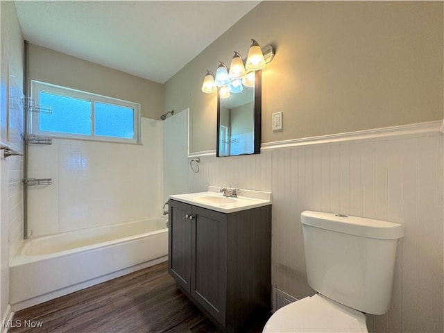 24525 Sherborne Rd, Bedford Heights, OH 44146 - bathroom with a wainscoted wall, vanity,  shower combination, and wood finished floors