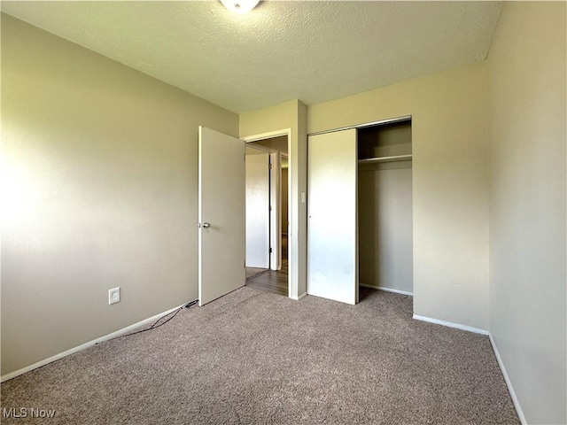 24525 Sherborne Rd, Bedford Heights, OH 44146 - unfurnished bedroom with carpet flooring, a closet, and a textured ceiling