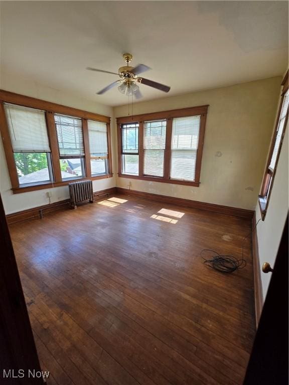 302 High St, Woodsfield, OH 43793 - spare room with radiator, ceiling fan, and hardwood / wood-style floors