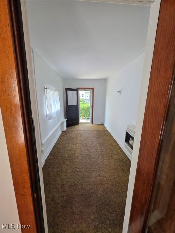 302 High St, Woodsfield, OH 43793 - unfurnished living room featuring carpet and heating unit