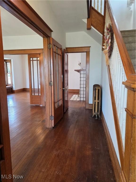 302 High St, Woodsfield, OH 43793 - hall with hardwood / wood-style floors, french doors, stairway, and lofted ceiling