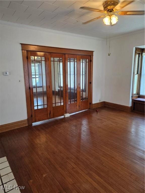 302 High St, Woodsfield, OH 43793 - empty room featuring ornamental molding, wood-type flooring, healthy amount of natural light, and a ceiling fan