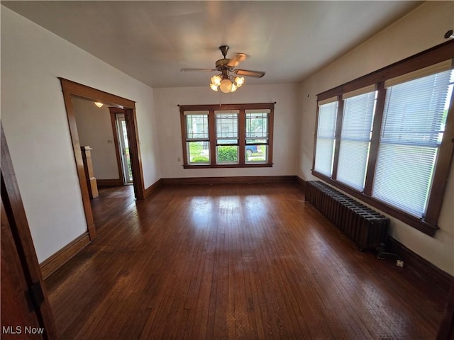 302 High St, Woodsfield, OH 43793 - spare room with radiator, dark wood-style flooring, and ceiling fan