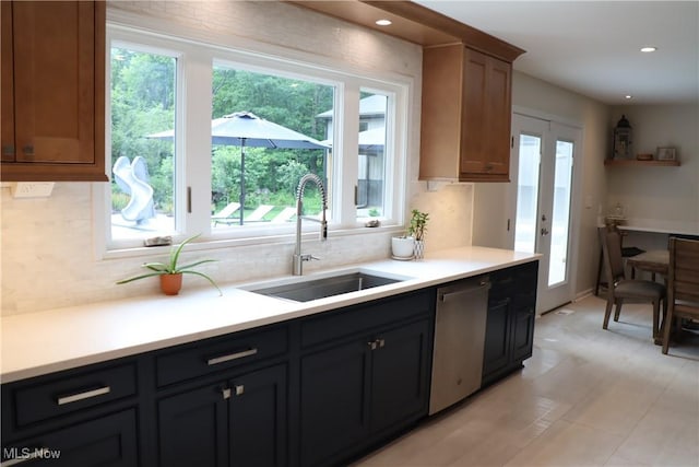 812 Spring Water Dr, Akron, OH 44333 - kitchen featuring stainless steel dishwasher, plenty of natural light, tasteful backsplash, light countertops, and recessed lighting