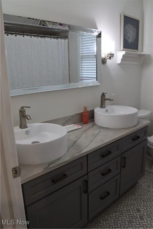 812 Spring Water Dr, Akron, OH 44333 - bathroom with double vanity and toilet