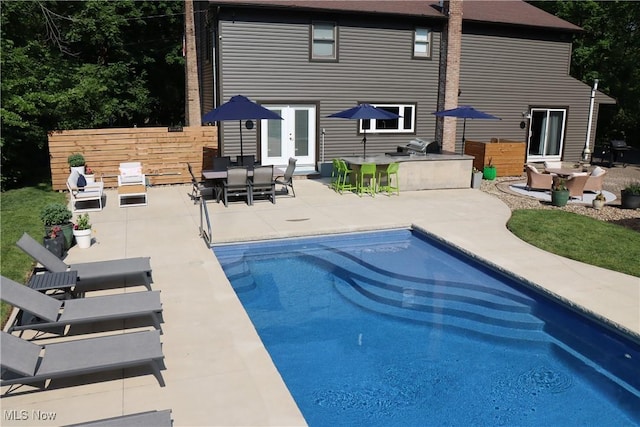 812 Spring Water Dr, Akron, OH 44333 - view of swimming pool with exterior kitchen and a patio