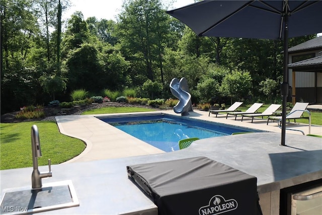 812 Spring Water Dr, Akron, OH 44333 - outdoor pool featuring a water slide and a patio