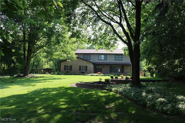 812 Spring Water Dr, Akron, OH 44333 - view of front of house with a front yard and stone siding