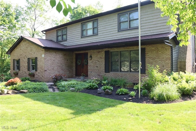 812 Spring Water Dr, Akron, OH 44333 - view of front of property with a front yard and brick siding