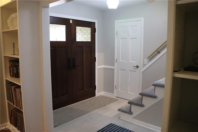812 Spring Water Dr, Akron, OH 44333 - entryway featuring stairs and wood finished floors