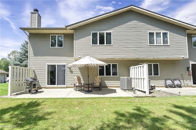 16891 Orchard Grove Dr Unit 16B, Middleburg Heights, OH 44130 - rear view of property with a chimney, a yard, and a patio