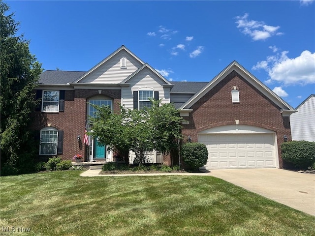 1741 Hamilton Dr, Broadview Heights, OH 44147 - traditional home with brick siding, concrete driveway, and a front lawn