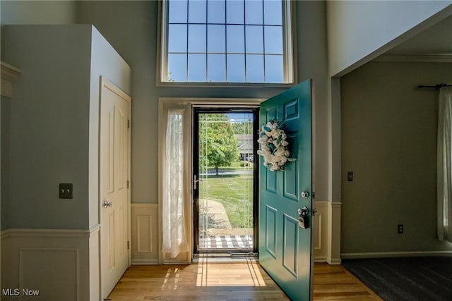 1741 Hamilton Dr, Broadview Heights, OH 44147 - foyer with wood finished floors, a wainscoted wall, and a decorative wall