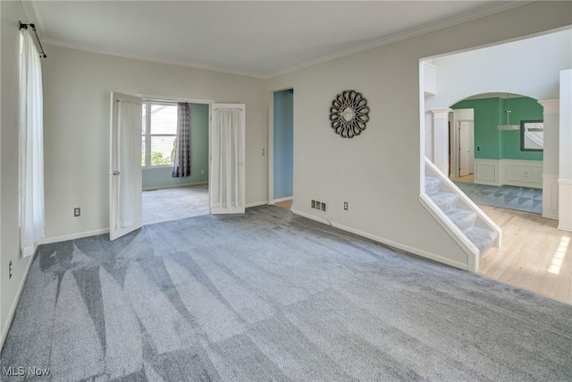 1741 Hamilton Dr, Broadview Heights, OH 44147 - unfurnished room with arched walkways, decorative columns, ornamental molding, and carpet
