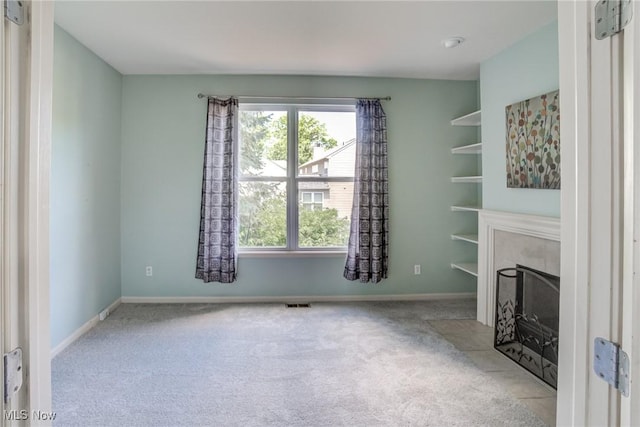 1741 Hamilton Dr, Broadview Heights, OH 44147 - unfurnished living room featuring carpet and a fireplace with flush hearth