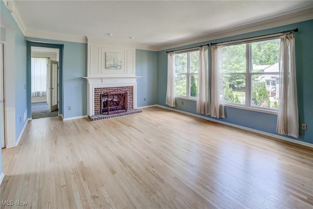 1741 Hamilton Dr, Broadview Heights, OH 44147 - unfurnished living room featuring ornamental molding, light wood-style flooring, and a fireplace