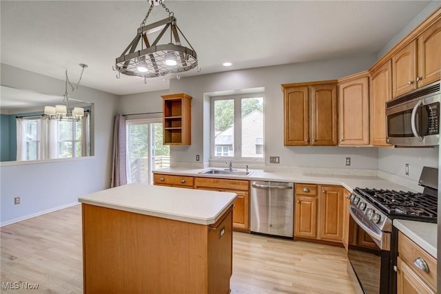 1741 Hamilton Dr, Broadview Heights, OH 44147 - kitchen featuring appliances with stainless steel finishes, a kitchen island, a chandelier, light wood-type flooring, and open shelves