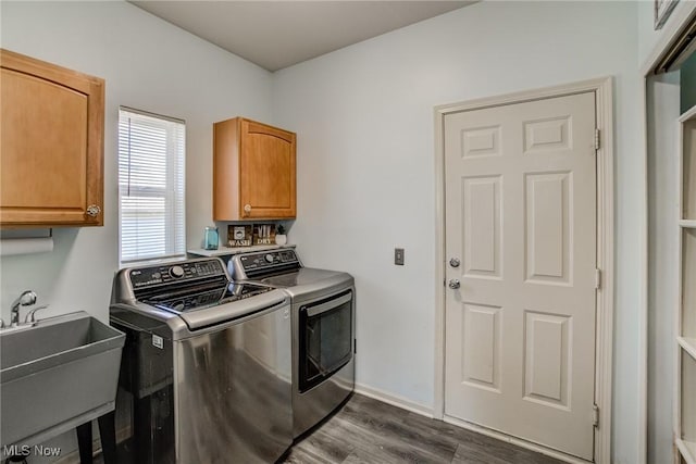1741 Hamilton Dr, Broadview Heights, OH 44147 - laundry room with cabinet space, washer and clothes dryer, and dark wood-style floors