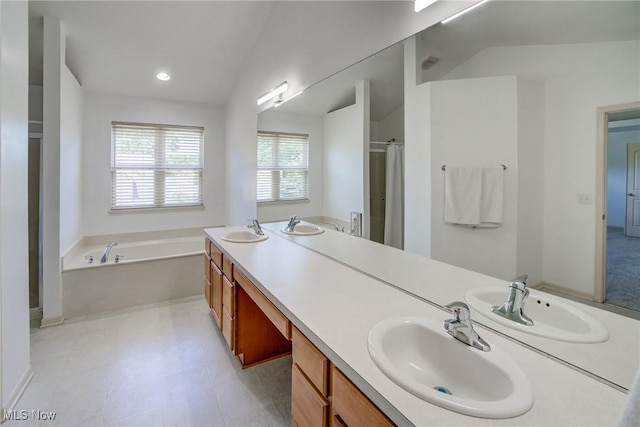 1741 Hamilton Dr, Broadview Heights, OH 44147 - full bath with a bath, a shower with curtain, double vanity, vaulted ceiling, and recessed lighting
