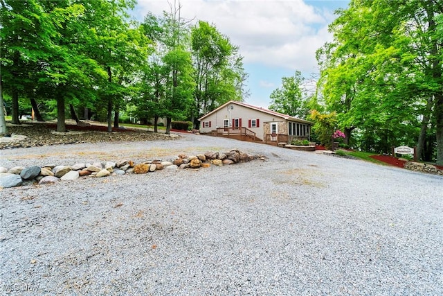 7235 Spillway Rd, Lisbon, OH 44408 - view of front of property featuring a deck and driveway