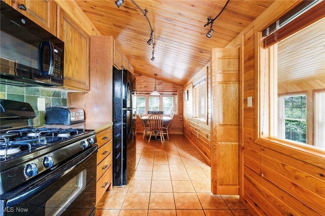 7235 Spillway Rd, Lisbon, OH 44408 - kitchen with black appliances, lofted ceiling, track lighting, wooden ceiling, and light tile patterned flooring
