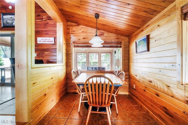 7235 Spillway Rd, Lisbon, OH 44408 - dining room with vaulted ceiling, wooden walls, wood ceiling, and dark tile patterned floors