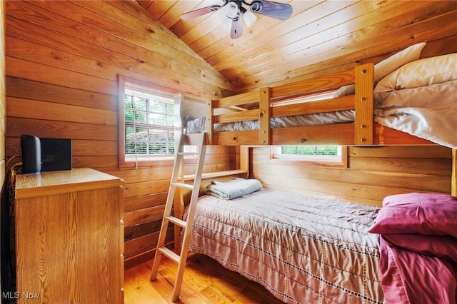 7235 Spillway Rd, Lisbon, OH 44408 - bedroom with lofted ceiling, wooden walls, wood finished floors, and wooden ceiling