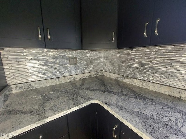 4985 State Route 213, Toronto, OH 43964 - kitchen with decorative backsplash, dark cabinets, and light stone counters