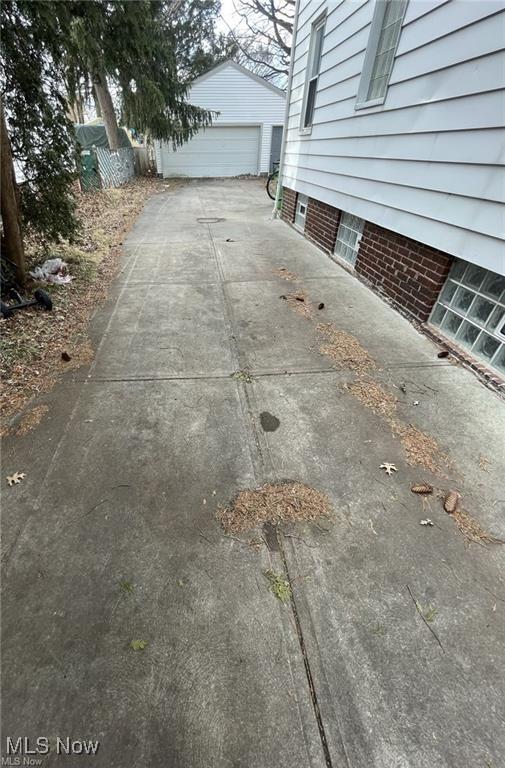 20520 Ball Ave, Euclid, OH 44123 - view of patio featuring a detached garage and an outdoor structure