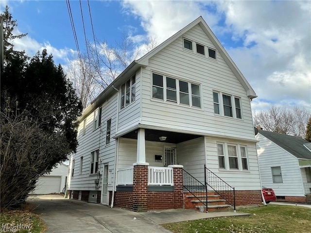 20520 Ball Ave, Euclid, OH 44123 - view of front of house with covered porch and an outbuilding