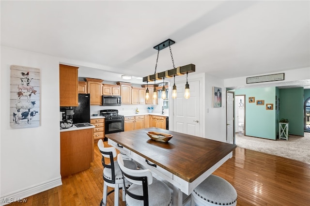 34765 Roberts Rd, Eastlake, OH 44095 - dining area featuring light wood-type flooring and baseboards