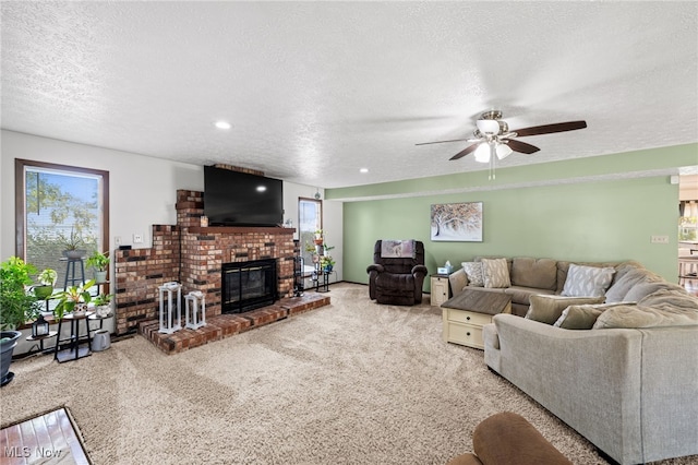 34765 Roberts Rd, Eastlake, OH 44095 - living room with carpet floors, a ceiling fan, a textured ceiling, a brick fireplace, and recessed lighting