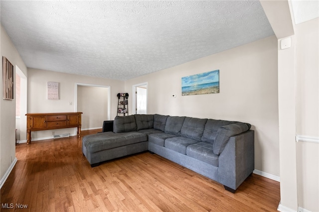 34765 Roberts Rd, Eastlake, OH 44095 - living room featuring wood finished floors and a textured ceiling