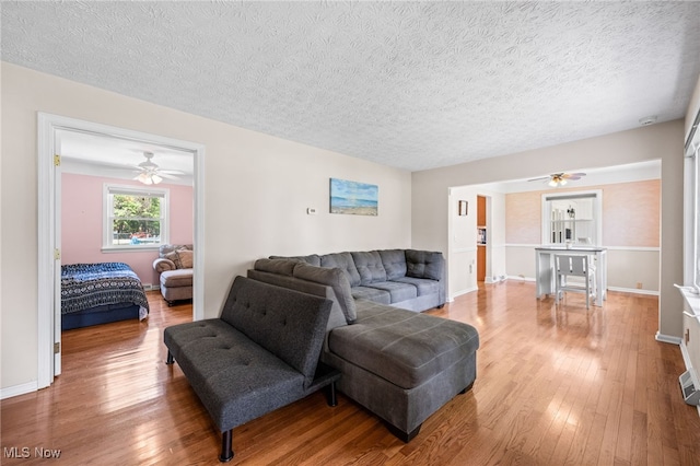 34765 Roberts Rd, Eastlake, OH 44095 - living room with ceiling fan, wood-type flooring, and a textured ceiling