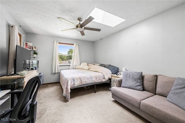 34765 Roberts Rd, Eastlake, OH 44095 - carpeted bedroom featuring a skylight, a ceiling fan, and a textured ceiling