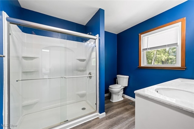 34765 Roberts Rd, Eastlake, OH 44095 - full bathroom featuring a stall shower, wood finished floors, and double vanity
