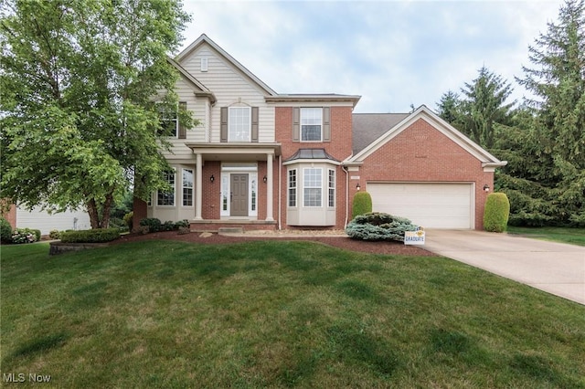 100 Hartford Ct, Broadview Heights, OH 44147 - traditional-style home with brick siding, driveway, an attached garage, and a front yard