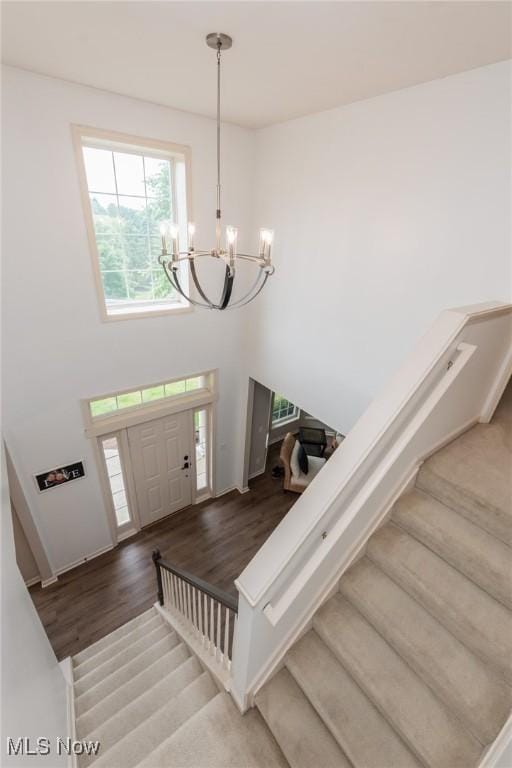 100 Hartford Ct, Broadview Heights, OH 44147 - foyer entrance with a chandelier, stairs, wood finished floors, and a towering ceiling