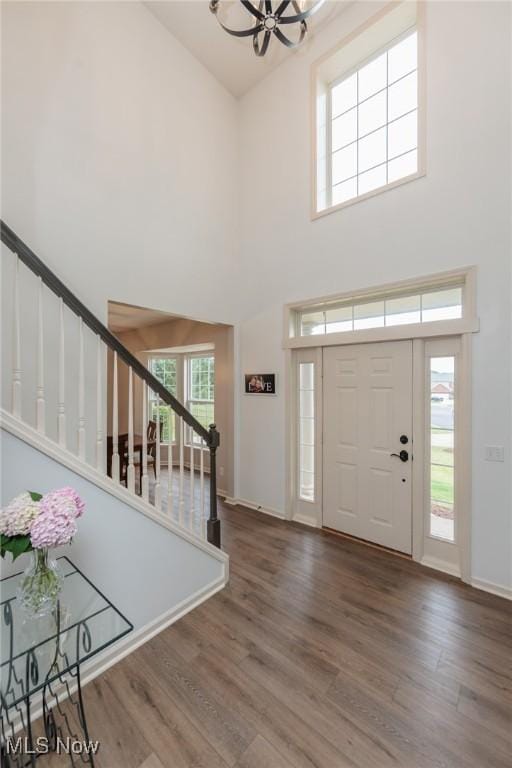 100 Hartford Ct, Broadview Heights, OH 44147 - foyer featuring a high ceiling, stairway, wood finished floors, and a chandelier