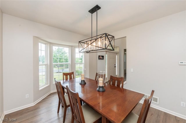 100 Hartford Ct, Broadview Heights, OH 44147 - dining room with wood finished floors and a chandelier