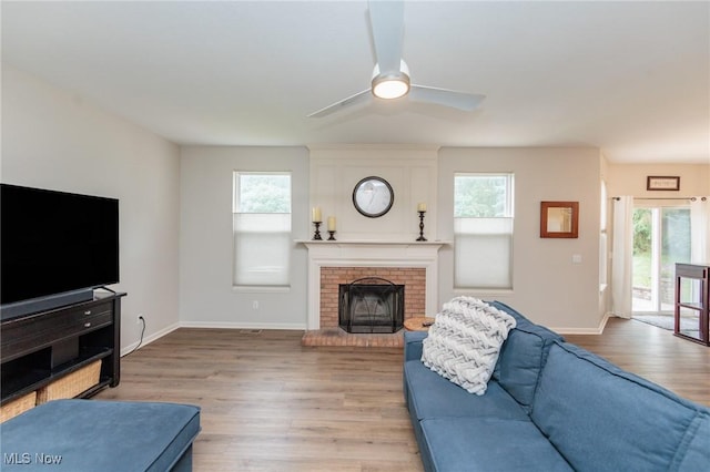 100 Hartford Ct, Broadview Heights, OH 44147 - living area with a ceiling fan, light wood-style flooring, and a fireplace