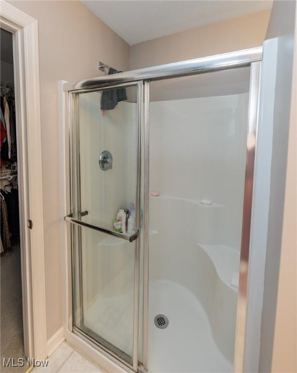 100 Hartford Ct, Broadview Heights, OH 44147 - full bathroom with a shower stall, a walk in closet, and tile patterned flooring