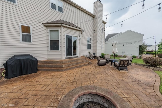 100 Hartford Ct, Broadview Heights, OH 44147 - view of patio with a grill, entry steps, and a fire pit